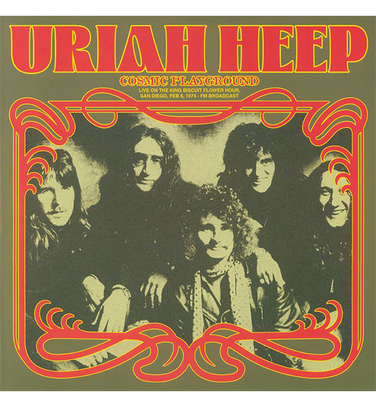 Front cover of the vinyl record ‘Uriah Heep – Cosmic Playground.’ The cover has a vintage design with a dark olive green background and features a sepia-toned photograph of the band members. The photograph is surrounded by an ornate red and yellow decorative frame. The band’s name, ‘Uriah Heep,’ is prominently displayed at the top in bold, red letters, and the album title ‘Cosmic Playground’ appears below in smaller text.