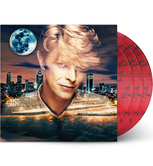 A mockup image of the vinyl record ‘David Bowie – Serious Moonlight Tour 1983.’ The cover shows a stylised portrait of David Bowie with his iconic blonde hairstyle, set against a vibrant cityscape at dusk with a large, luminous moon in the sky. The discs are red with black splatter patterns, partially visible on the right side of the image. The overall design reflects a dynamic and surreal aesthetic, capturing the essence of Bowie’s theatrical and bold style.