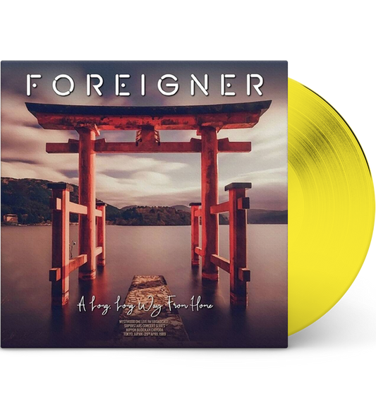 Foreigner ‘A Long Long Way From Home’ vinyl record mockup. The album cover features a serene landscape with a red Torii gate overlooking a calm body of water and distant mountains under a cloudy sky. The text on the cover includes the album title and details: ‘Westwood One Live FM Broadcasts, Superstar Concert Series, Nippon Budokan, Tokyo, Japan, 29th April 1989.’ The vinyl is displayed in a vibrant yellow colour.