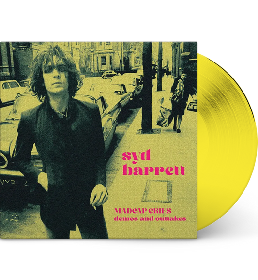 Vinyl record with a cover featuring a person on a street, yellow disc, and text 'syd barrett'.
